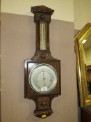 A SMALL OAK ANEROID BAROMETER H-73 CM