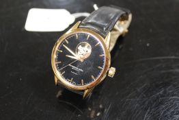 A RAYMOND WEIL AUTOMATIC WRISTWATCH WITH SKELETON WINDOW TO DIAL AT 12 O'CLOCK AND TO REVERSE,
