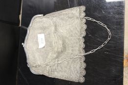 A VINTAGE WHITE METAL MESH PURSE WITH JEWELLED CLASP