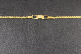 A HALLMARKED 9CT GOLD BRACELET WITH CENTRAL DIAMOND LINK - APPROX 2.9 G