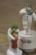 A COALPORT THE SNOWMAN FIGURE ENTITLED 'THE HUG' TOGETHER WITH ROYAL DOULTON THE SNOWMAN GIFT
