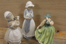 A ROYAL DOULTON FIGURINE BUTTERCUP, TOGETHER WITH TWO NAO FIGURES (3)