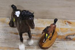 A BESWICK MODEL OF A CANTERING SHORE TOGETHER WITH A BESWICK MODEL OF A FOAL ON A PLINTH (2)