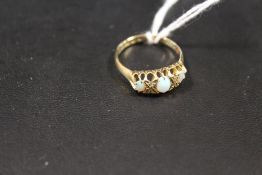 A HALLMARKED 18CT GOLD THREE STONE OPAL RING - APPROX WEIGHT 2.3 G
