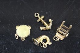 FOUR 9CT GOLD CHARMS