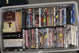 A TRAY AND A BOX OF DVDS - UNCHECKED