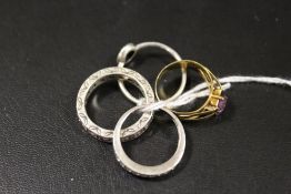 AN AMETHYST STYLE STONE SET RING STAMPED 333, TOGETHER WITH TWO SILVER RINGS AND ANOTHER (4)