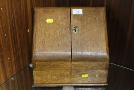 A VINTAGE WOODEN STATIONARY BOX