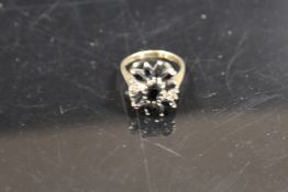 A 9CT GOLD LARGE SAPPHIRE CLUSTER DRESS RING