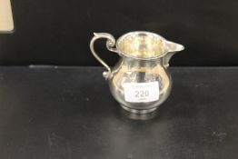 A HALLMARKED SILVER CREAM JUG - BIRMINGHAM 1913