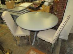 A LARGE MODERN PEDESTAL TABLE WITH TWO CHAIRS