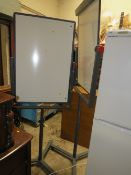 A PAIR OF REVOLVING WHITE BOARDS ON STANDS