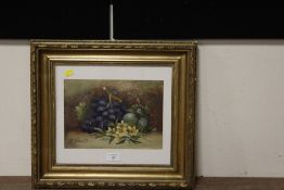 A GILT FRAMED AND GLAZED OIL ON BOARD STILL LIFE STUDY OF FRUIT AND FLOWERS, INDISTINCTLY SIGNED