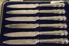 A CASED SET OF HALLMARKED SILVER HANDLED KNIVES