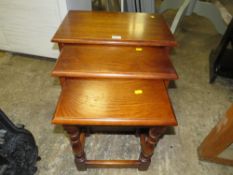 AN OAK NEST OF THREE TABLES TOGETHER WITH A PINE CHAIR AND A MAGAZINE RACK