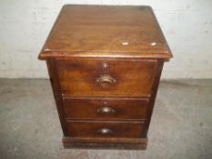AN ANTIQUE CHEST OF DRAWERS