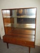 A RETRO TEAK LOW DISPLAY CABINET WITH GLASS SLIDING DOOR
