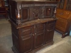 AN OAK COURT CUPBOARD