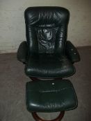 AN EKORNES STRESSSLESS SWIVEL CHAIR AND STOOL
