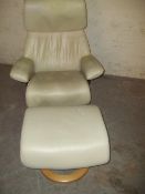 AN EKORNES STRESSLESS SWIVEL CHAIR AND STOOL