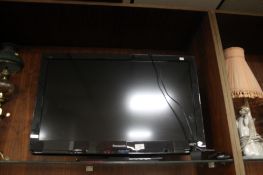 A PANSONIC 32 INCH FLAT SCREEN TV WITH REMOTE