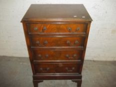A REPRODUCTION CHEST OF FOUR DRAWERS