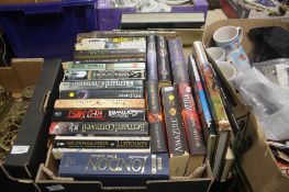 A TRAY OF ASSORTED BOOKS (TRAY NOT INCLUDED)