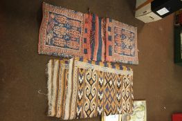 A PAIR OF VINTAGE EASTERN SADDLE BAGS AND A RUG