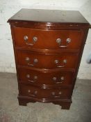A REPRODUCTION CHEST OF DRAWERS WITH SERPENTINE FRONT