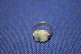A SILVER AND JADE SIGNET RING