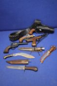 A BOX OF IMITATION/REPRODUCTION PISTOLS TOGETHER WITH A BOWIE KNIFE, A KUKRI KNIFE ETC