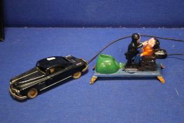 A VINTAGE PREIMA REMOTE CONTROL CAR TOGETHER WITH A CAST MONEY BANK