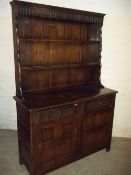 AN OAK DRESSER IN ERCOL STYLE