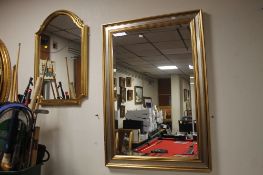 A PAIR OF MODERN GILT FRAMED MIRRORS THE LARGEST BEVEL EDGED 100 CM X 70 CM