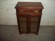 AN OAK ANTIQUE COLLECTORS CABINET