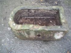 AN ANTIQUE STONE PLANTER
