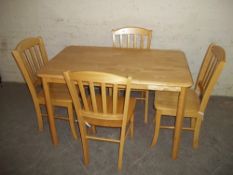 A MODERN KITCHEN TABLE AND A SET OF 4 CHAIRS