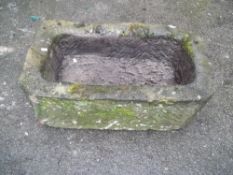 AN ANTIQUE STONE PLANTER