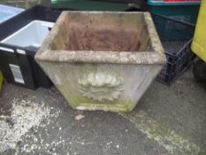 A LARGE CONCRETE PLANTER