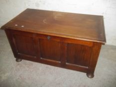AN OAK PANELED BLANKET CHEST