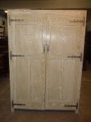 A LIMED OAK 2 DOOR WARDROBE