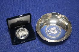 A HALL MARKED SILVER SIR WINSTON CHURCHILL DISH AND A U S EAGLE COIN
