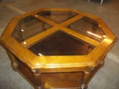 A MODERN GLASS AND WOOD COFFEE TABLE