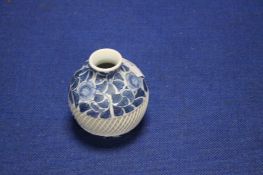 A SMALL ORIENTAL BLUE AND WHITE VASE
