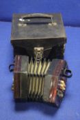 AN ANTIQUE CASED ACCORDION