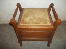 AN ANTIQUE STORAGE PIANO STOOL