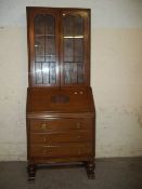 A LEATHER INLAID OAK BUREAU BOOKCASE