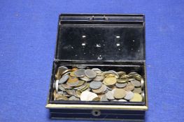 AN OLD FASHIONED SAVINGS BOX WITH KEY CONTAINING A LARGE QUANTITY OF FOREIGN COINS
