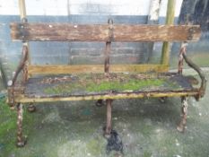 AN ANTIQUE CAST AND WOOD GARDEN BENCH