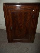AN ANTIQUE MAHOGANY CORNER CABINET